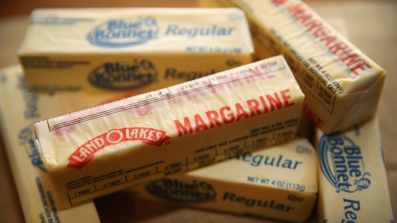 Stacked sticks of various margarine brands