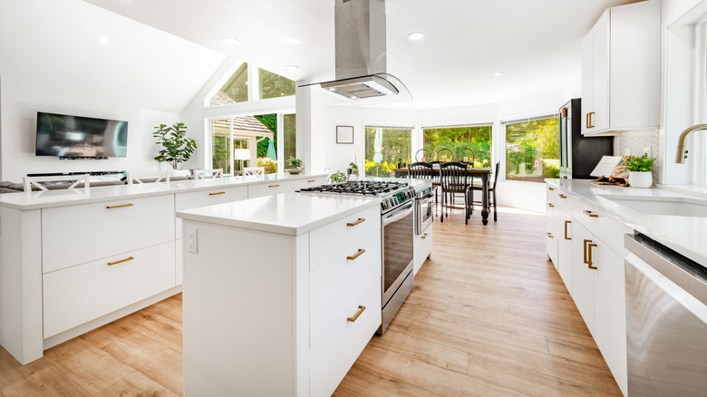 two kitchen islands in a white kitchen