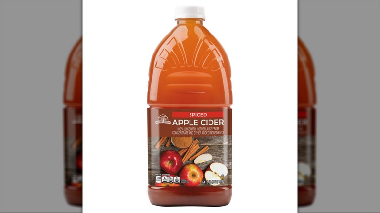 A container of Nature's Nectar Spiced Apple Cider.