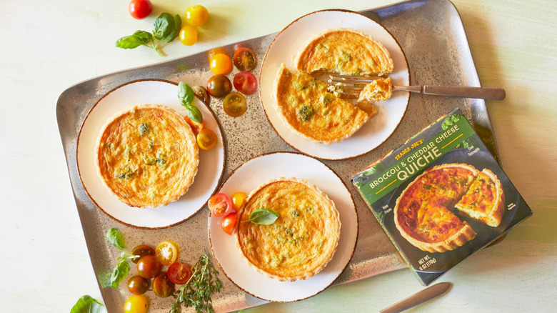 Prepared Trader Joe's Broccoli & Cheddar Cheese Quiches sit on a serving tray
