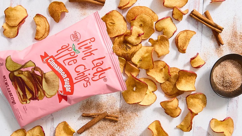 Apple chips spill from a Pink Lady Apple Chips bag