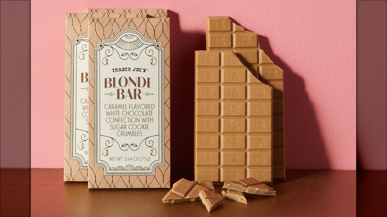 Wrapped Trader Joe's Blonde Bars propped against a pink wall