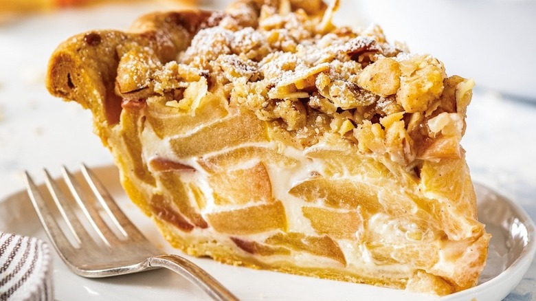 Apple pie on plate with fork