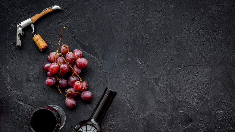 bottle of wine with corkscrew