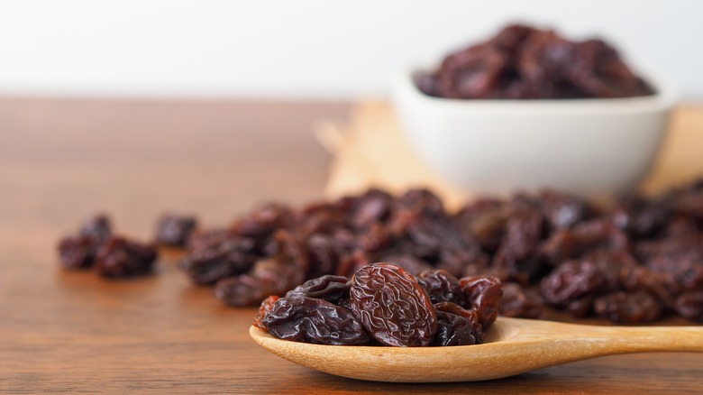 raisins on a wooden spoon