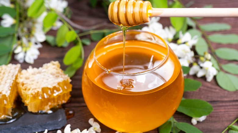 runny honey in glass bowl