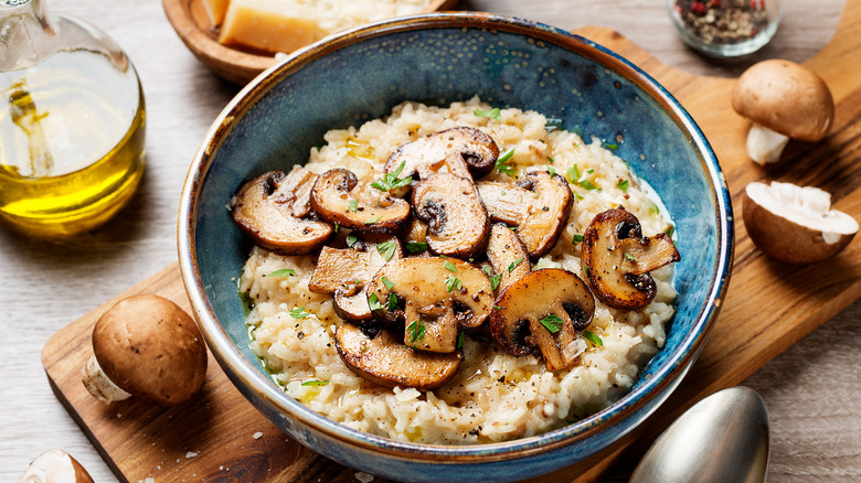 mushroom risotto in blue bowl