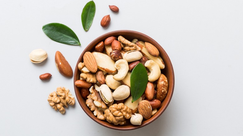 mixed nuts in brown bowl