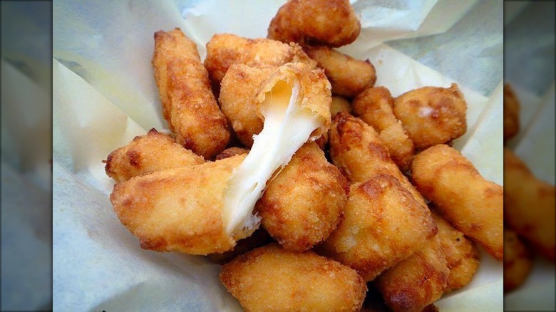 A&W cheese curds sit on serving paper