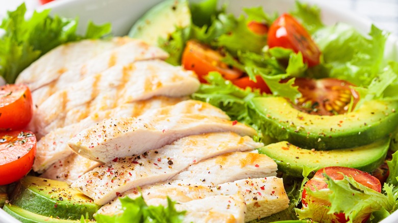 sliced chicken, tomato and avocado
