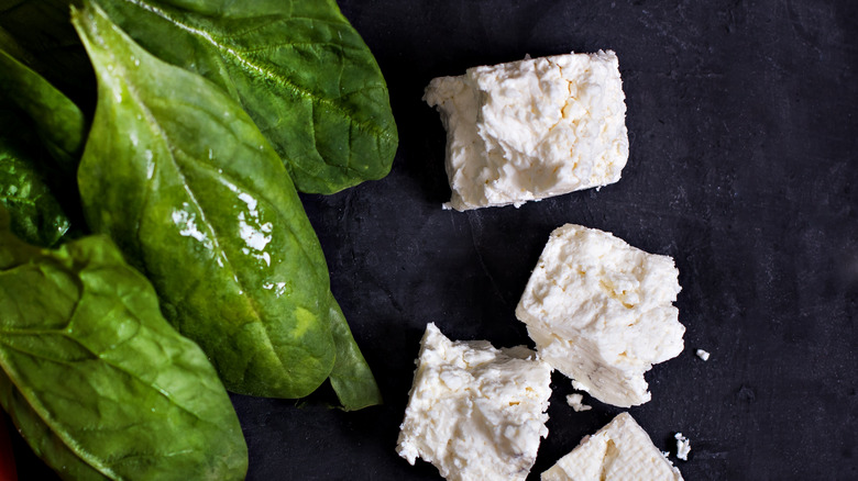 spinach and feta on slate