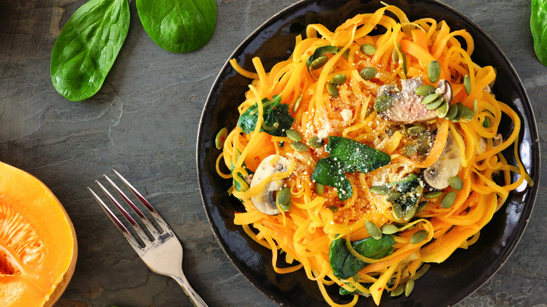Squash noodles in black bowl