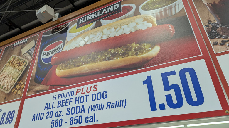 Sign advertising Costco Food Court Hot Dog Combo hangs in store.