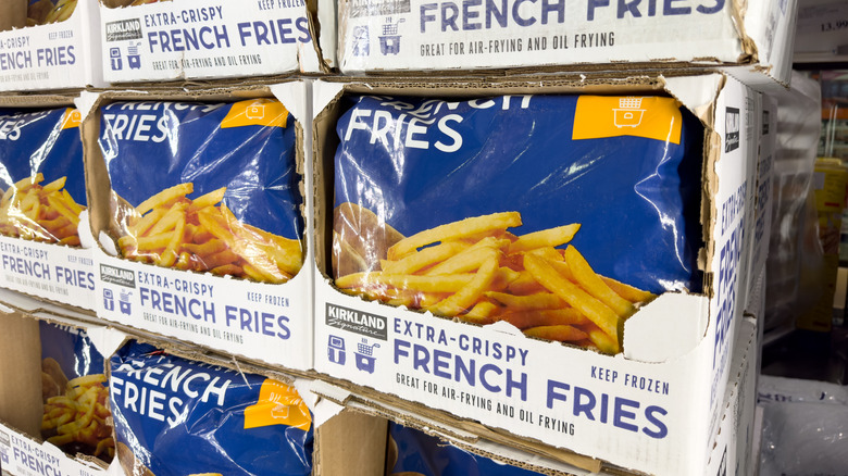 Bags of Kirkland Signature Extra Crispy French Fries are on display in store freezer