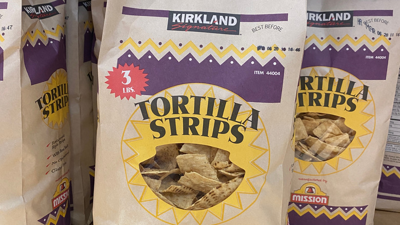 Bags of Kirkland Signature Organic Tortilla Strips are shown close-up.
