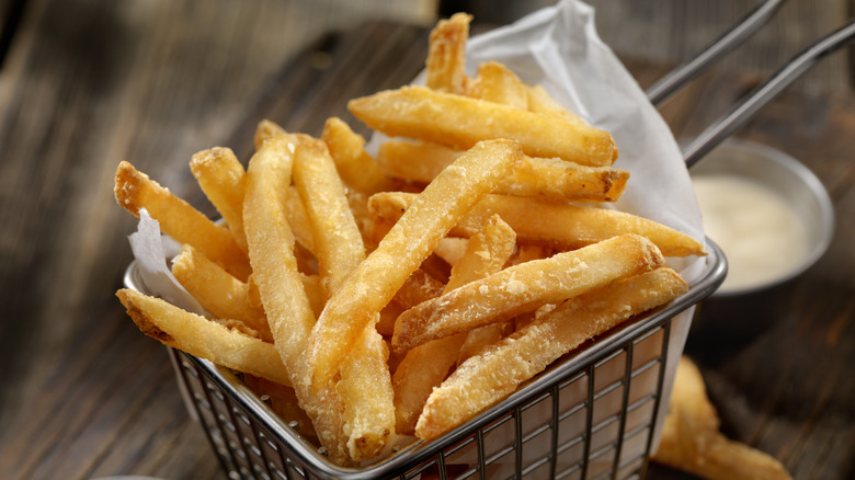 Battered fries in metal basket