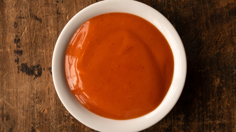 Ceramic bowl of buffalo sauce