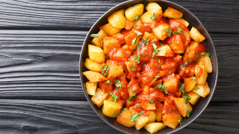 Overhead view of a bowl of patatas bravas