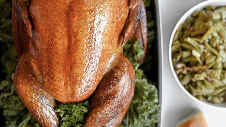 Close-up of City BBQ Turkey with a side of green beans