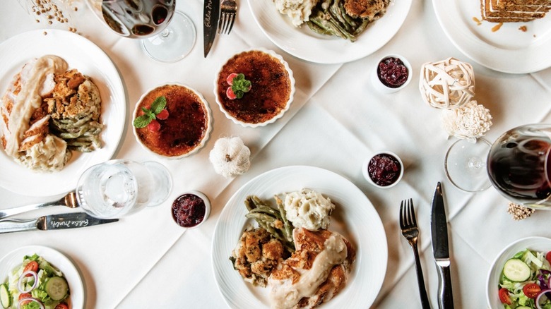 Overhead view of a table set with Eddie Merlot's Thanksgiving food