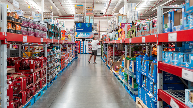 A shopper browses the aisles at a Sam's Club.