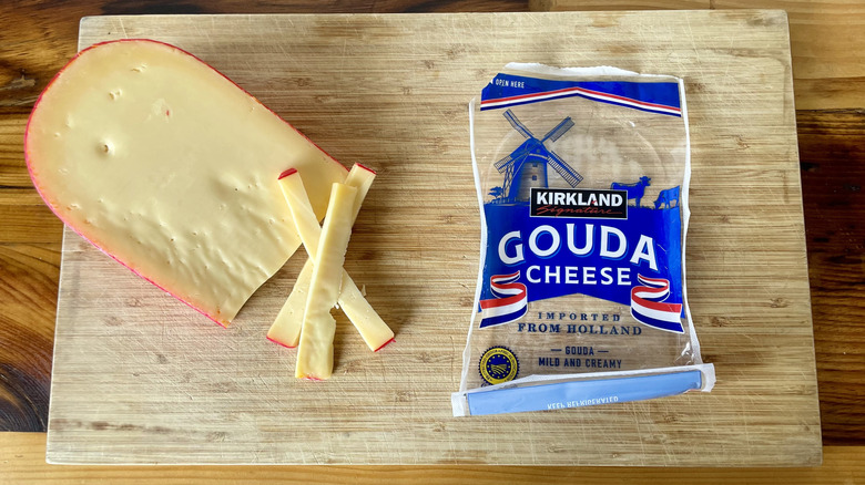 Overhead view of Kirkland Signature Gouda Cheese on a cutting board