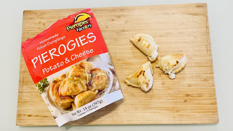 Bag of Pierogies Factory Potato & Cheese Pierogies with cooked ones alongside
