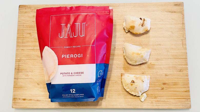 Bag of Jaju Potato & Cheese Pierogi with cooked ones alongside