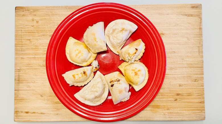 Plate with various brands of cooked pierogies