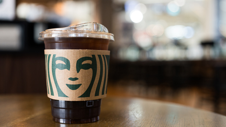 A grande iced cup has either iced coffee or an iced double espresso with a hot sleeve featuring the siren's face
