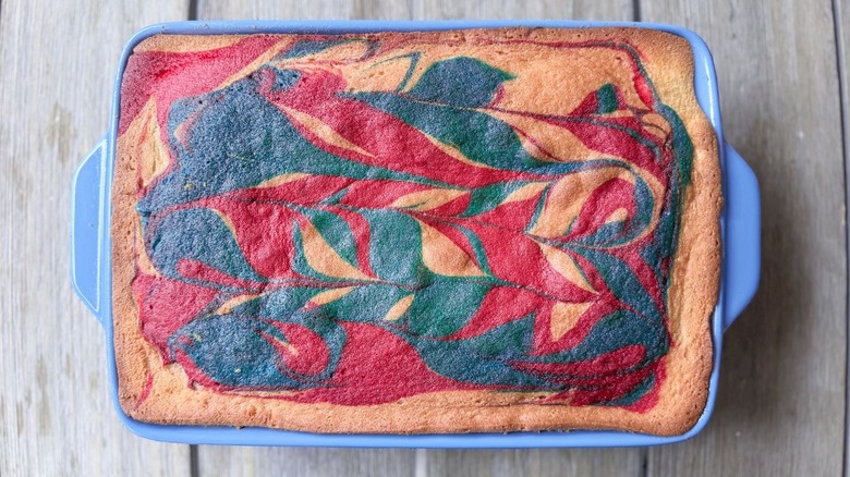 4th of July American flag cake cooling in blue baking dish