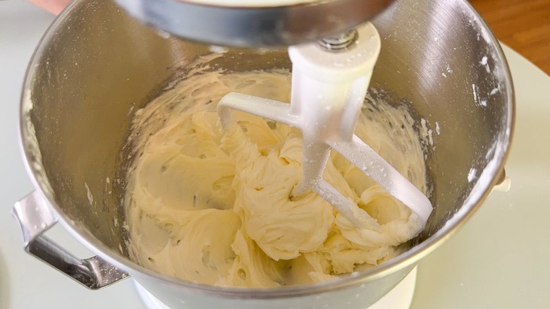 Creamed butter and confectioner's sugar in stand mixer bowl