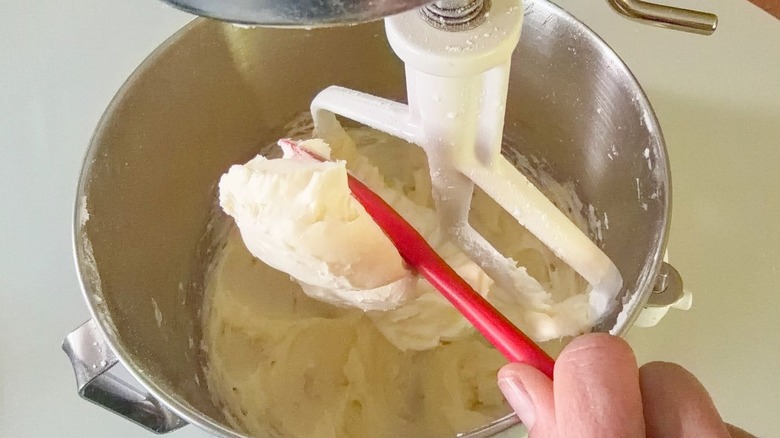 Adding mascarpone to vanilla icing in stand mixer bowl
