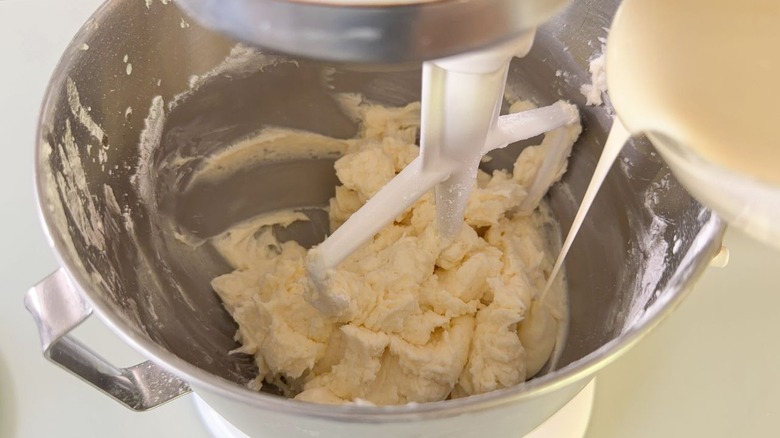 Adding melted white chocolate to vanilla icing