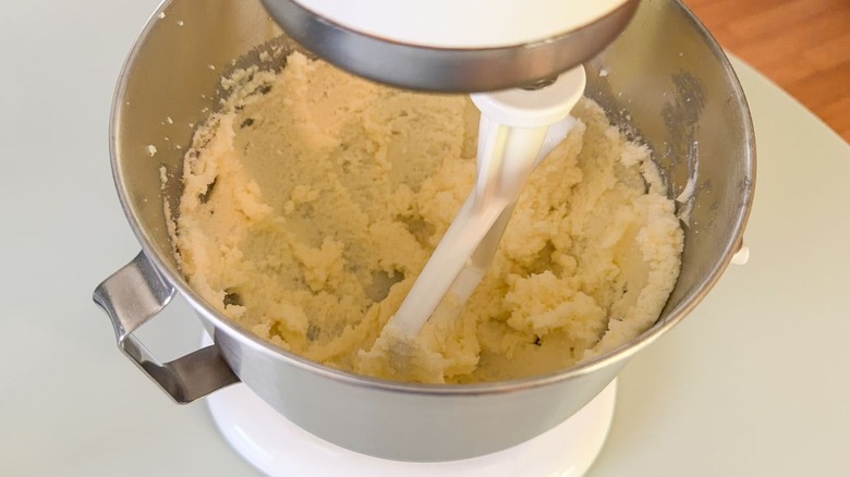 Creamed butter and sugar in stand mixer bowl with paddle attachment