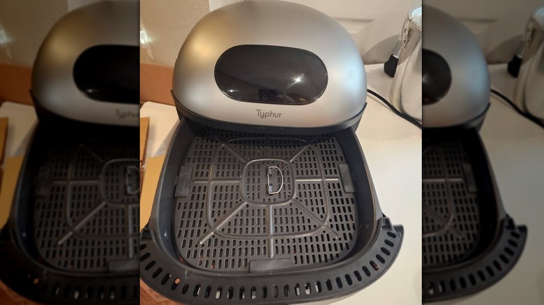 Typhur air fryer with interior basket displayed.