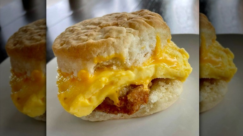 A Chick-fil-A Chicken, Egg, and Cheese Biscuit sits on a white plate