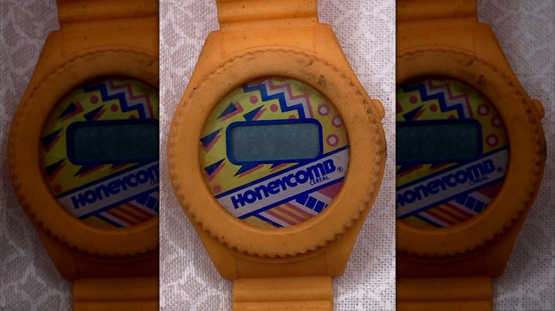 An orange Honeycomb digital watch