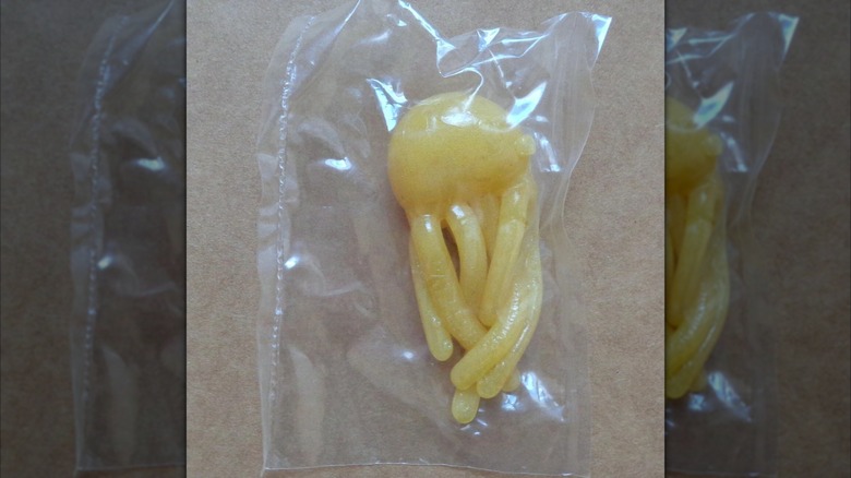 A wrapped yellow Wacky WallWalker prize