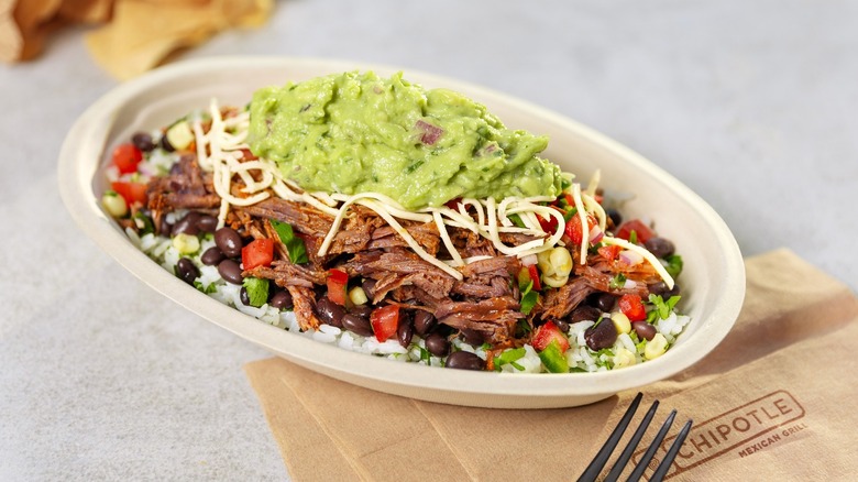 A Chipotle burrito bowl topped with guacamole