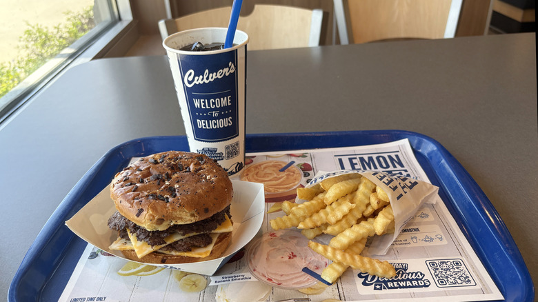 Burger, fries, and drink from Culver's on a tray.