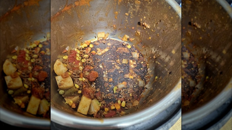 The scorched bottom of an Instant Pot.
