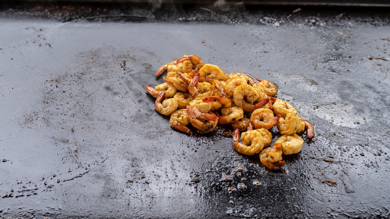 Shrimp on a tilted Blackstone griddle