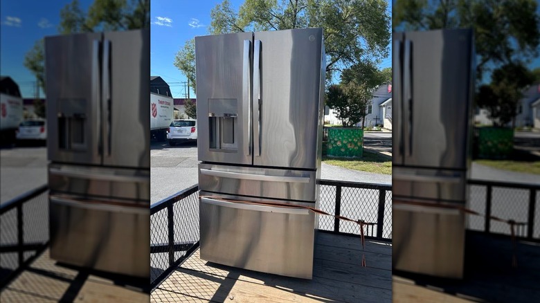 GE fridge transported outside.