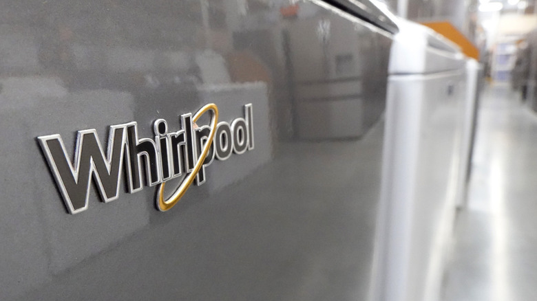 The Whirlpool logo on an appliance