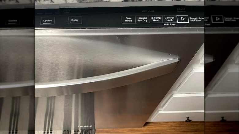 A dishwasher with a visible control panel