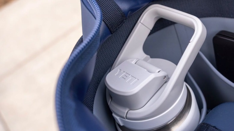 A Yeti water bottle sits in a bag.