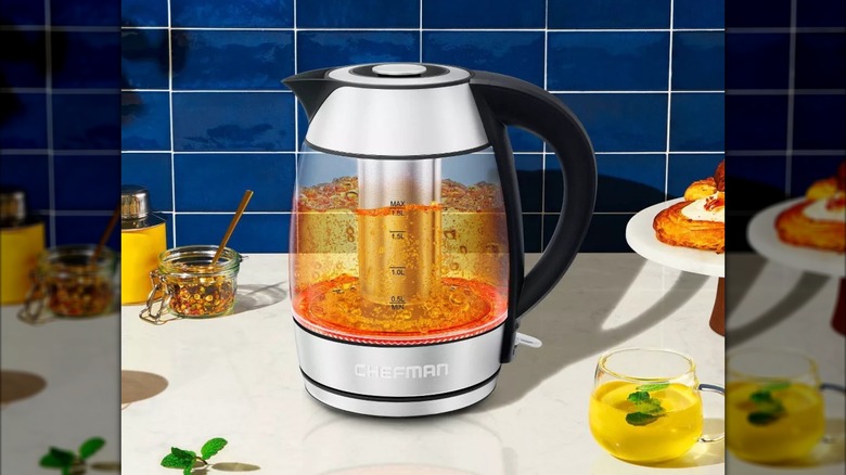 A Chefman Custom-Temp Electric Kettle boiling water