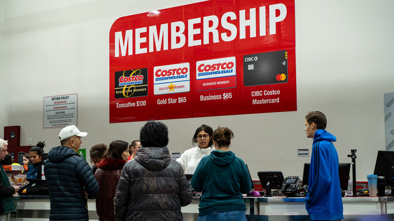 Customers at Costco's membership counter.