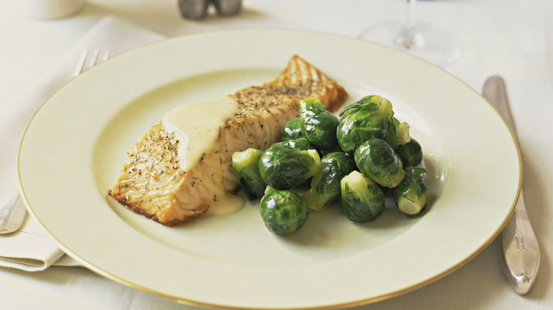 Salmon, topped with beurre blanc.
